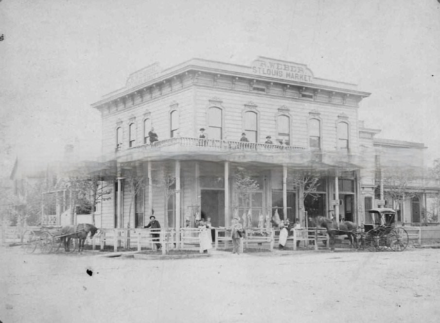 #36 Twelve persons pose in front of Rudolph Weber’s St. Louis Market at 1030 H Street (southwest corner of 11th and H Streets)., 1885