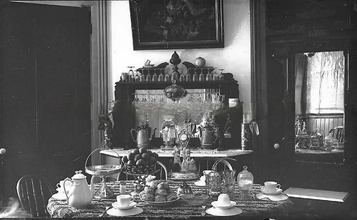 #92 View of dining table and buffet set with tea, scones, and fruit, 1888