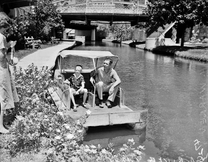 #20 John H. Warren and son Bill in a paddle boat on San Antonio River, 1956