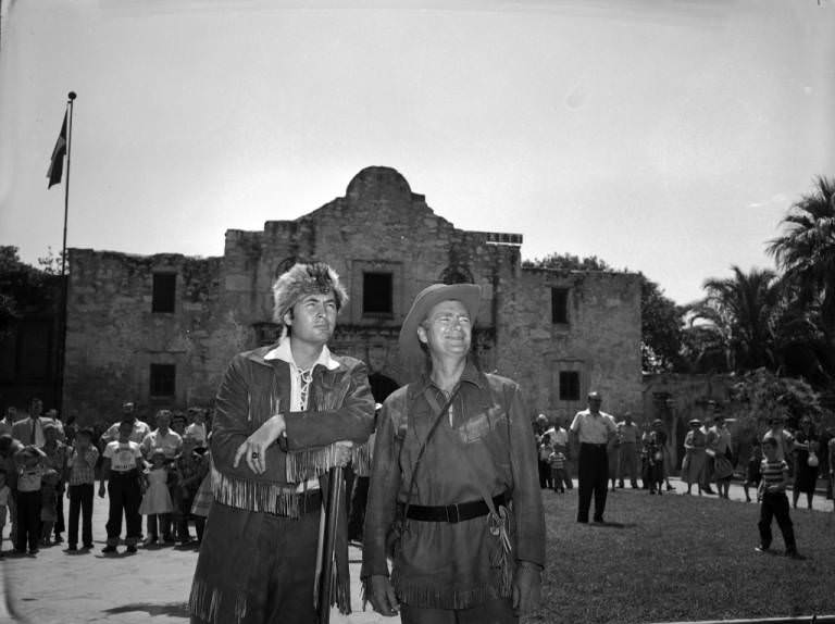 #13 Fess Parker and Buddy Ebsen outside the Alamo, 1955