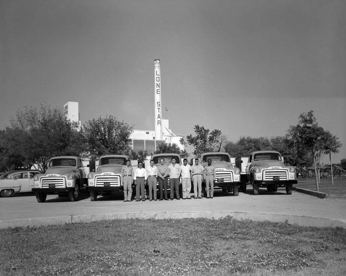 #60 Employees in front of trucks at Lone Star Brewing Company, 542 Simpson Street, 1954