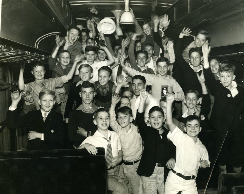 #165 Some of the members of the Globe-Democrat 1935 Boys’ Outing Club, who took time inspect the engine as their special train stopped in Jefferson City yesterday en route to Bagnell Dam on a two-day outing, 1935