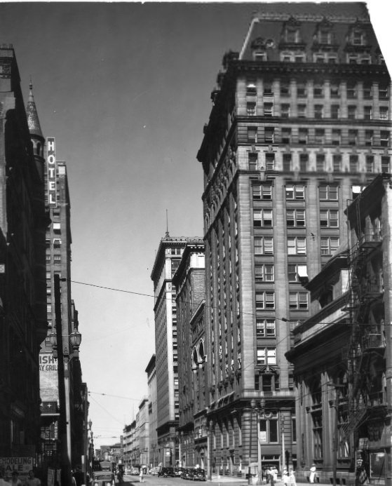 #27 A Glimpse Along the Wall Street of St. Louis, 1935. Looking north on Broadway from Pine street, where numerous banking institutions make their home.