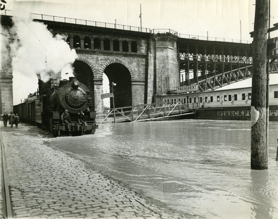 #57 A train steaming in the overflow at Eads Bridge, 1939