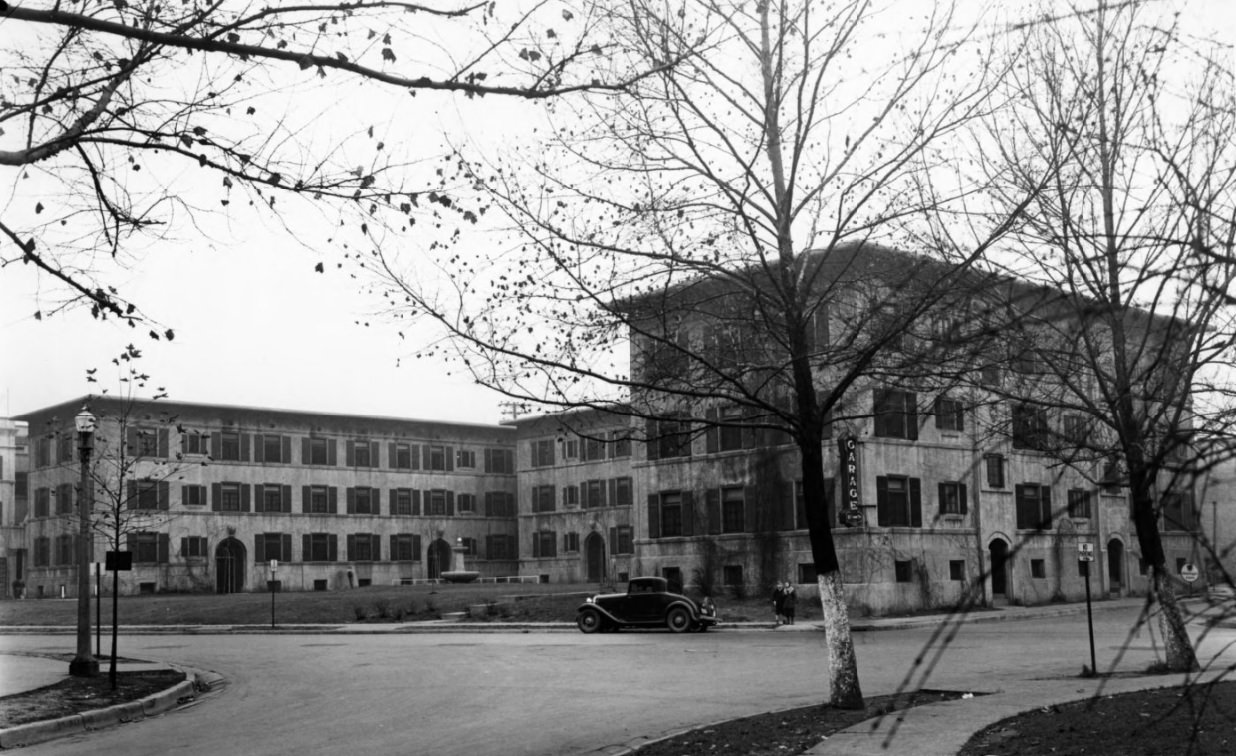 #96 A street view of the Donaldson Court Apartments at Delmar and Westgate, where the courtyard can be seen, 1935
