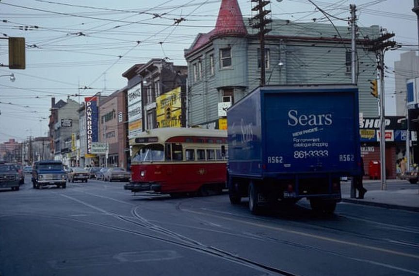 #67 Streetcar turning south onto Church past a Sears delivery van, February 13, 1980.
