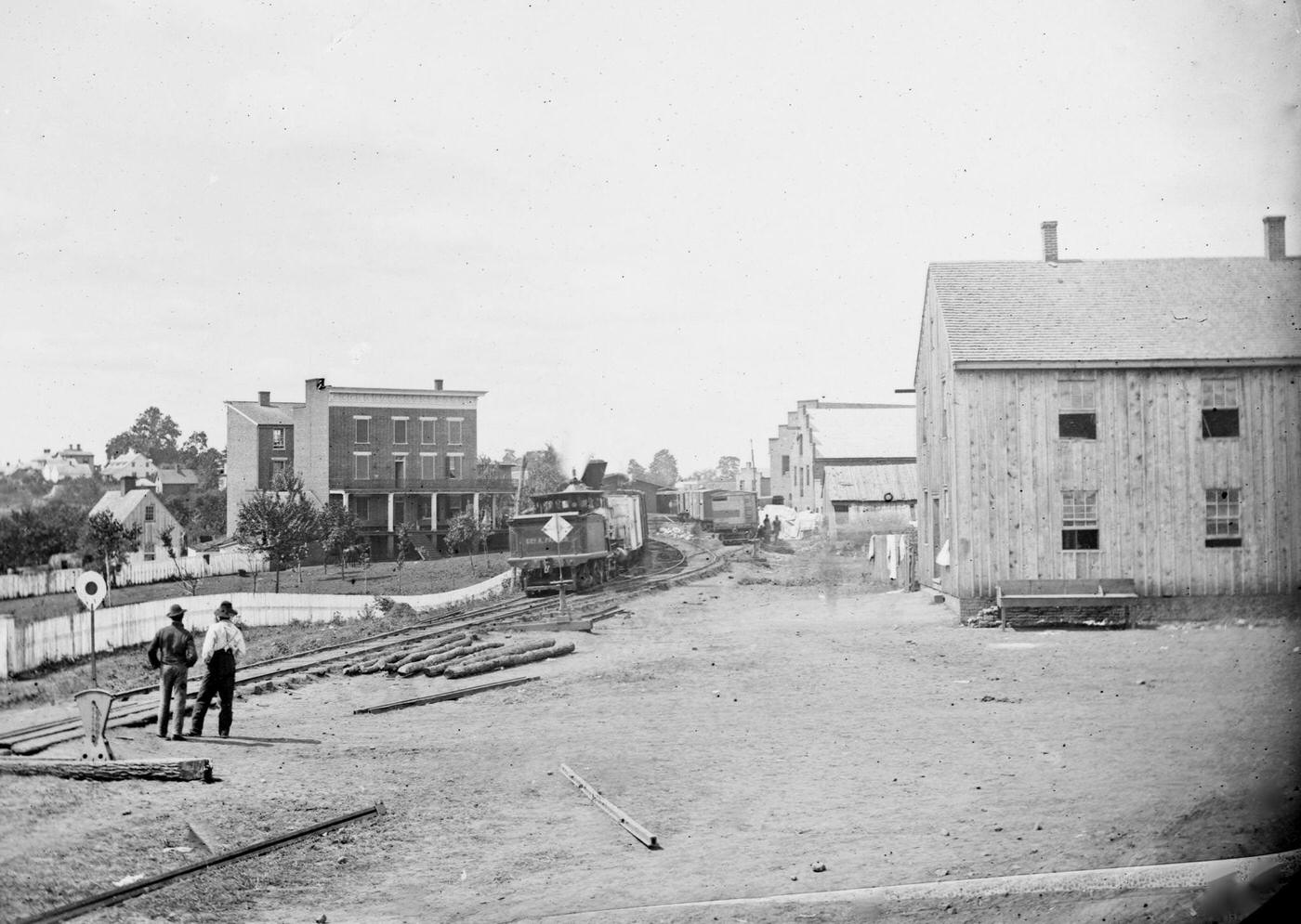 #79 View near train depot showing a locomotive on the Orange & Alexandria Railroad, Culpeper Court House, VA, 1862.