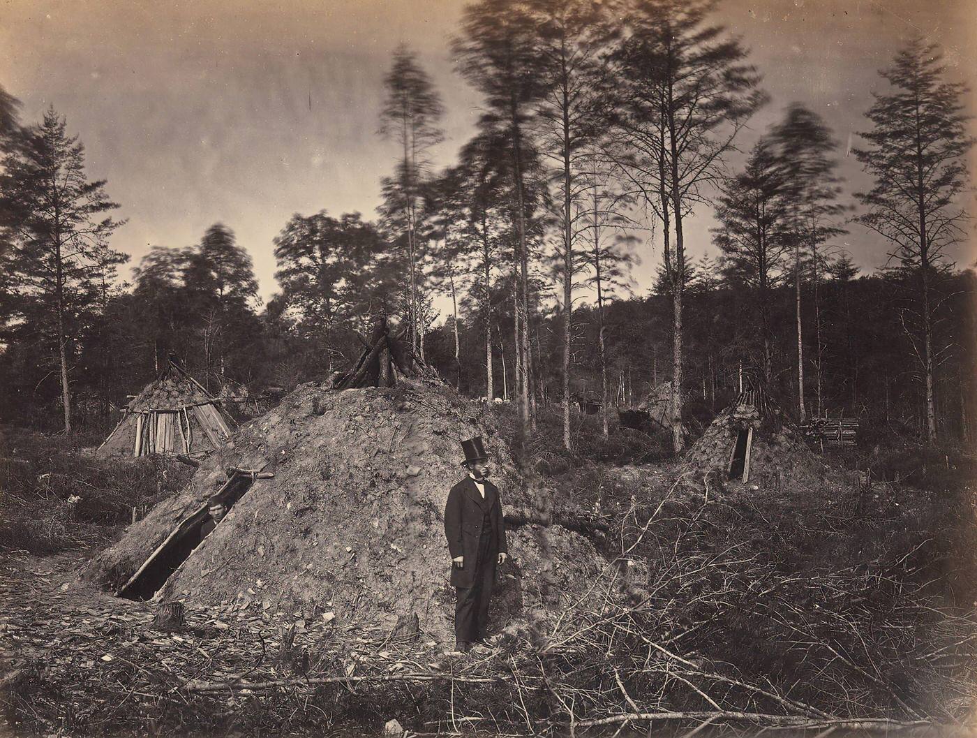#91 Woodchoppers’ Huts in a Virginia Forest. On the Orange & Alexandria Railroad. Wood Supplied U.S.M.R. Railroads under Supervision of Major Brayton, June 1863.