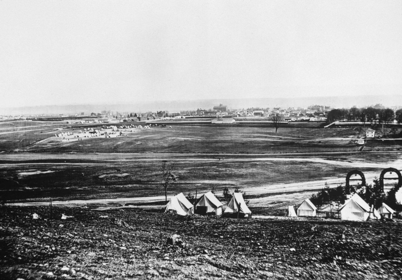#157 View of Alexandria, Virginia, tents of the 44th New York Infantry in foreground during the US civil war. Alexandria was captured by the Union in 1861.