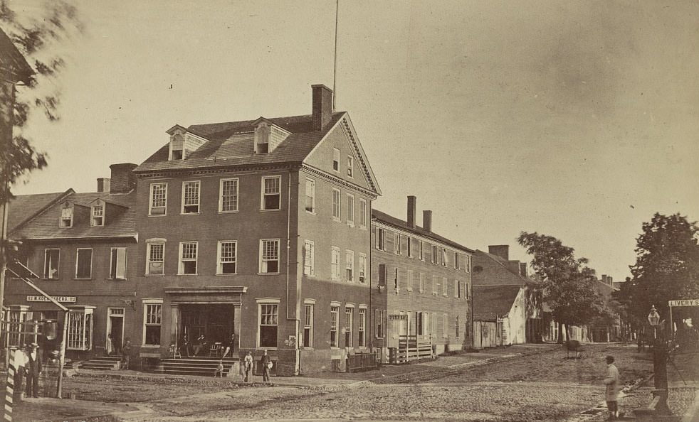 #36 A group of people in front of the Marshall House at the corner of King and St. Asaph Streets, Alexandria, 1863