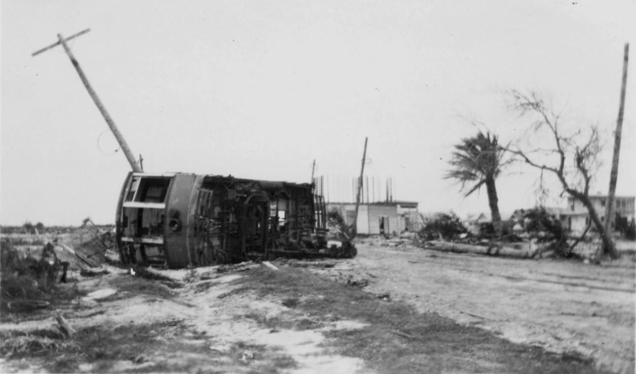 #59 An overturned streetcar in the middle of the road in Corpus Christi, Texas around the time of a hurricane in 1919.