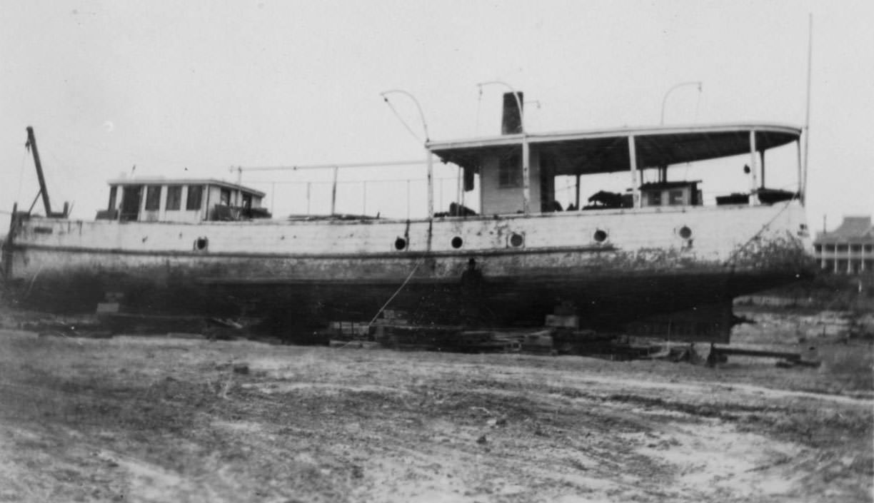 #60 The Japonica sitting on the beach in Corpus Christi, Texas around the time of a hurricane in 1919.