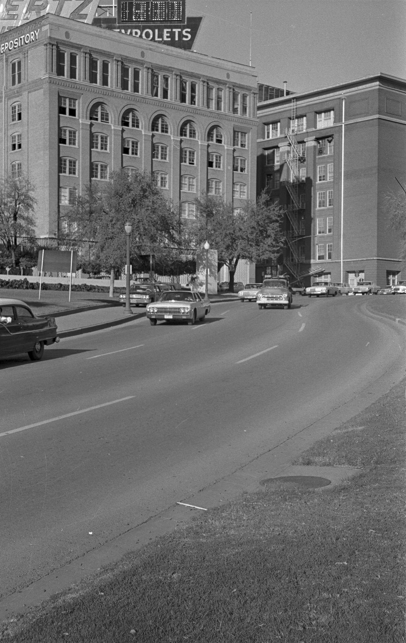 #121 Looking toward Texas School Book Depository, Dealey Plaza, following John F. Kennedy assassination, 1963