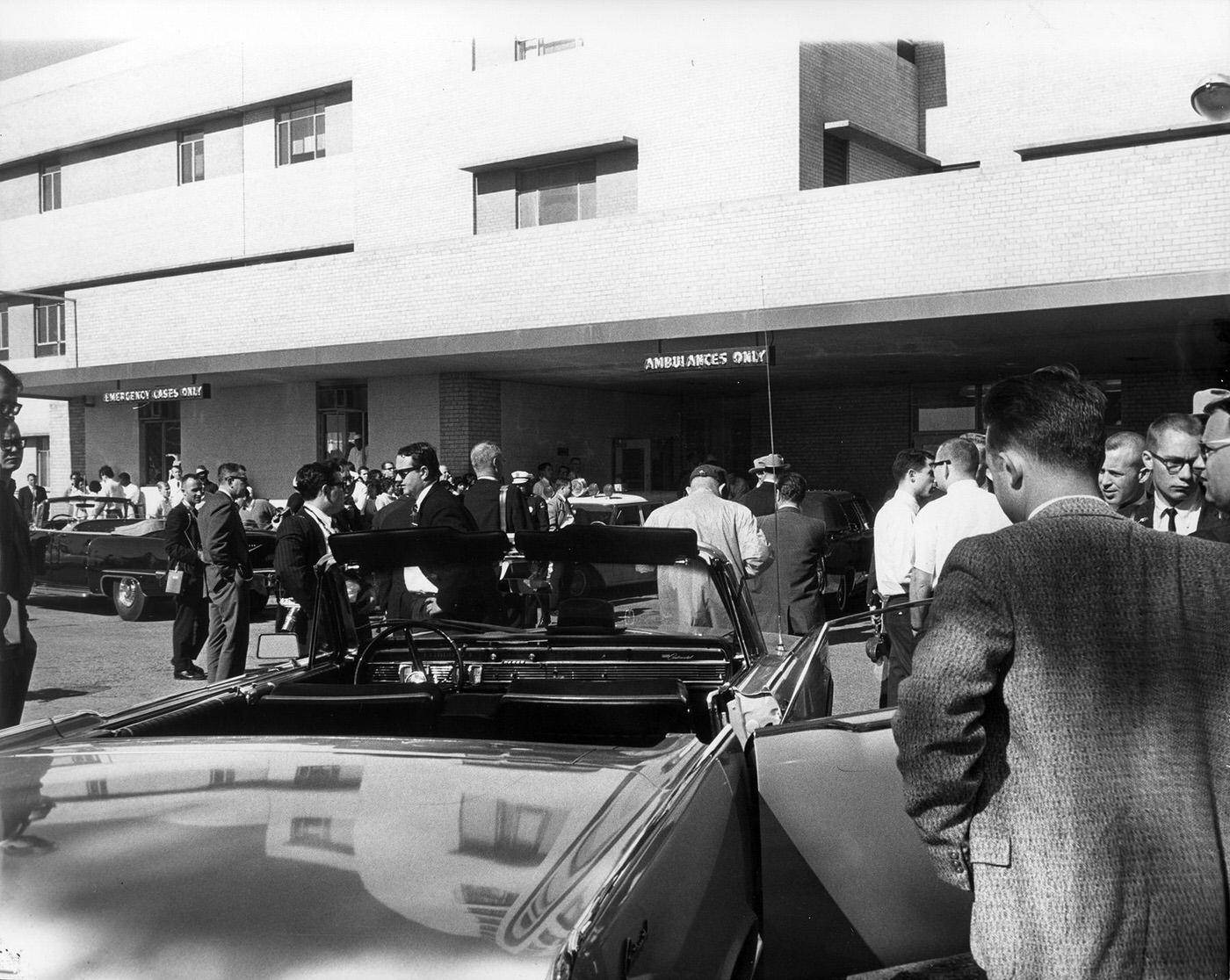 #148 Crowd awaiting news outside Emergency Room entrance of Parkland Hospital following assassination of President John F. Kennedy, 1963