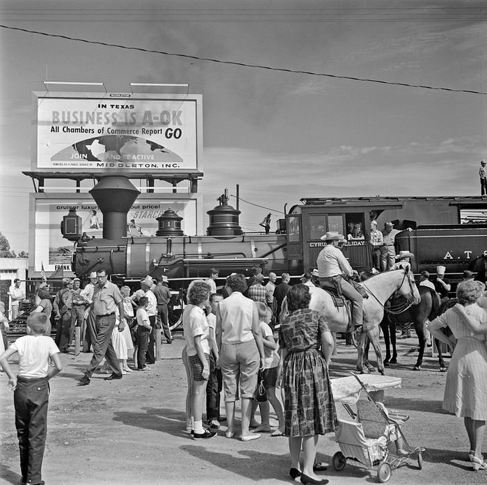 #194 The Atchison, Topeka, & Santa Fe Railroad made a stop in Garland during summer 1965 to an excited crowd.
