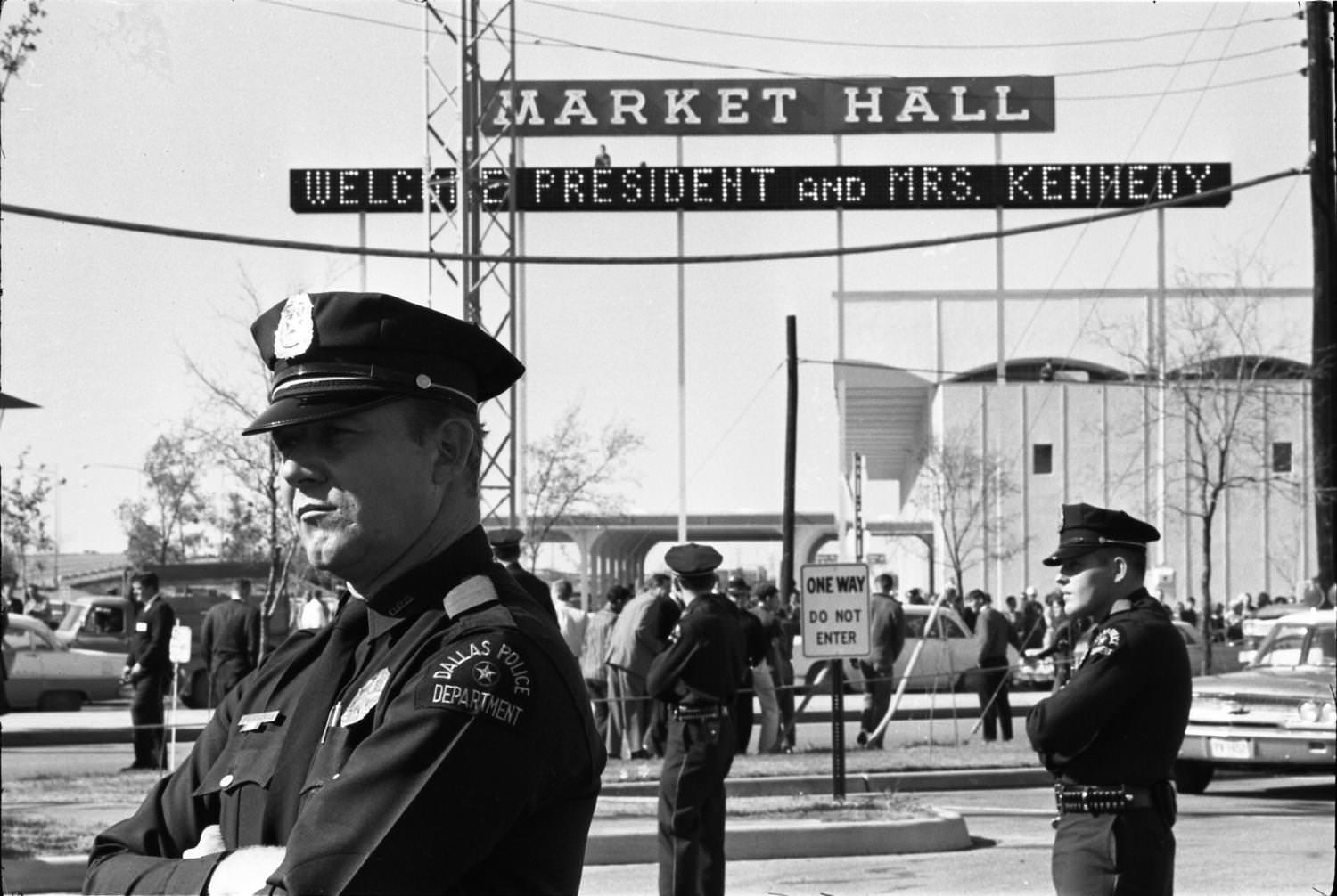 #24 Dallas Police officers standing guard outside the Dallas Trade Mart, 1963