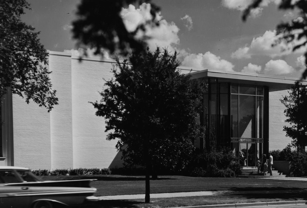 #66 Tall glass entrance with two doors and a sign above them that reads “Dallas Garden Center’, 1968