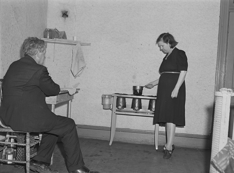 #19 Man and wife from South Carolina. He just got a job in shipyards, moved into this one room apartment, rent eight dollars a week. Newport News, Virginia, 1941