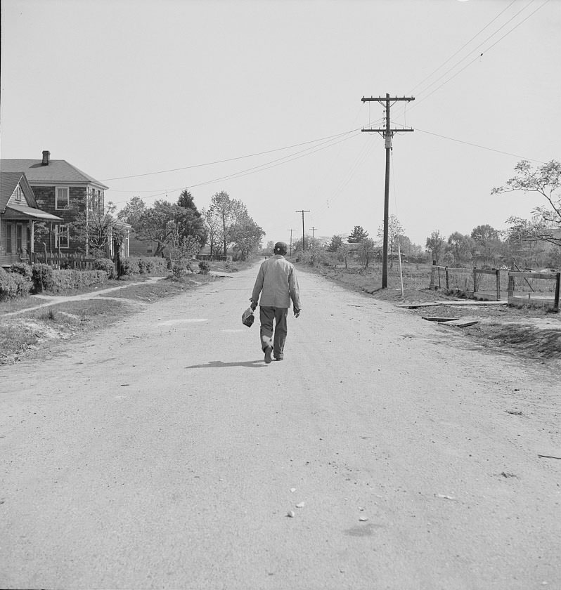 #53 Shipyard worker leaving his rural home for the shipyards with his lunch box, 1942