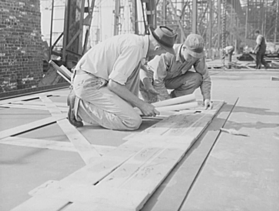#20 These workers are marking off the design for a ship’s plate, using a template as a guide, 1941