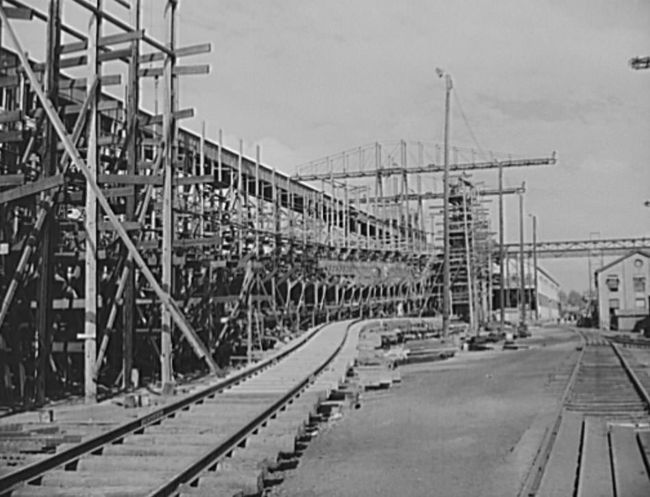 #51 This railroad spur is used for hauling materials onto the ways, where naval vessels are under construction. Huge overhead cranes are used to put heavy parts in place, 1941