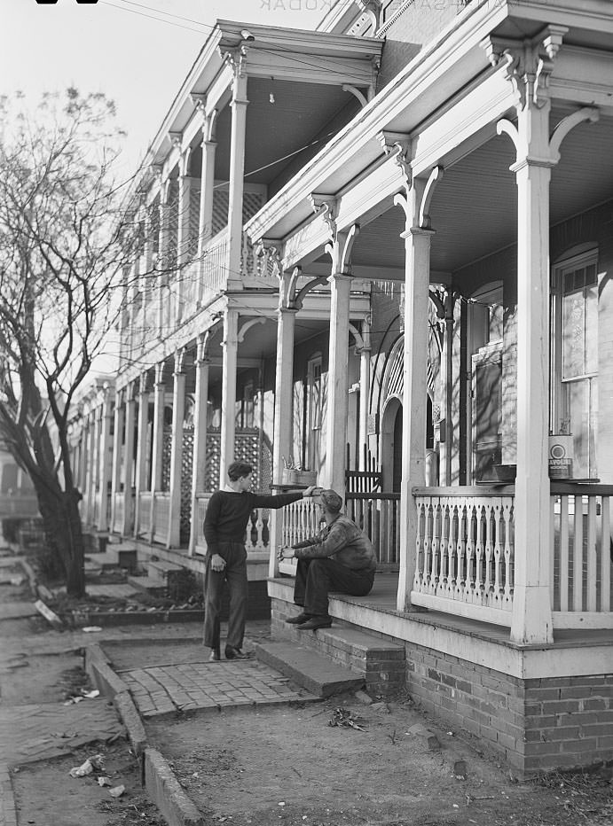 #3 Defense workers in front of rooming houses. Norfolk, Virginia, 1941