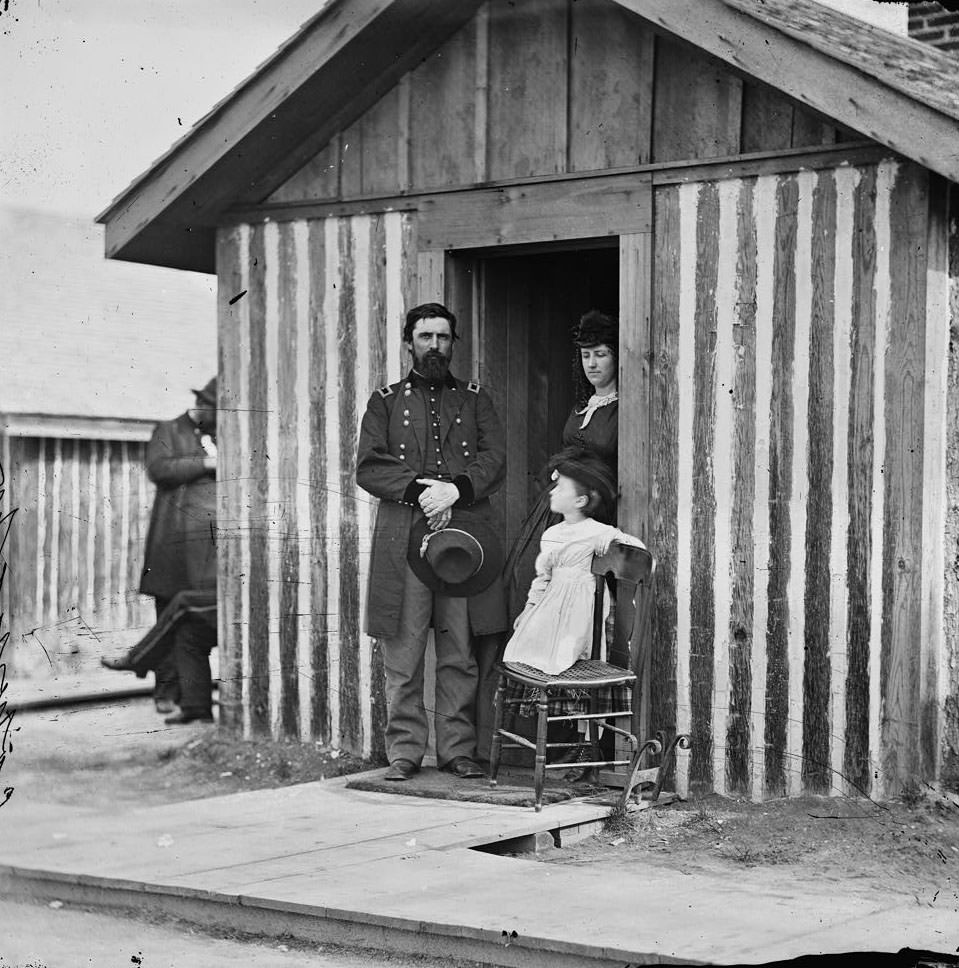 #15 Brig. Gen. John A. Rawlins, Chief of Staff, with wife and child at door of their quarters, Petersburg, 1860