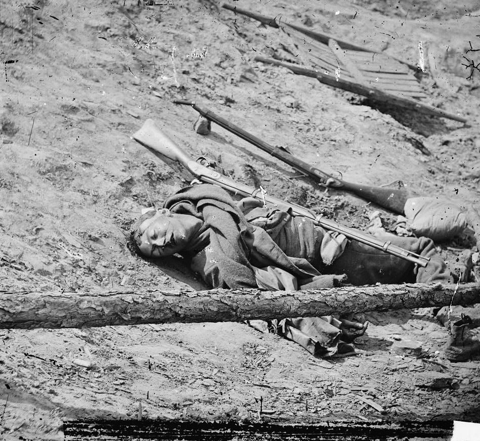 #164 Dead Confederate soldier with gun, Petersburg, 1865