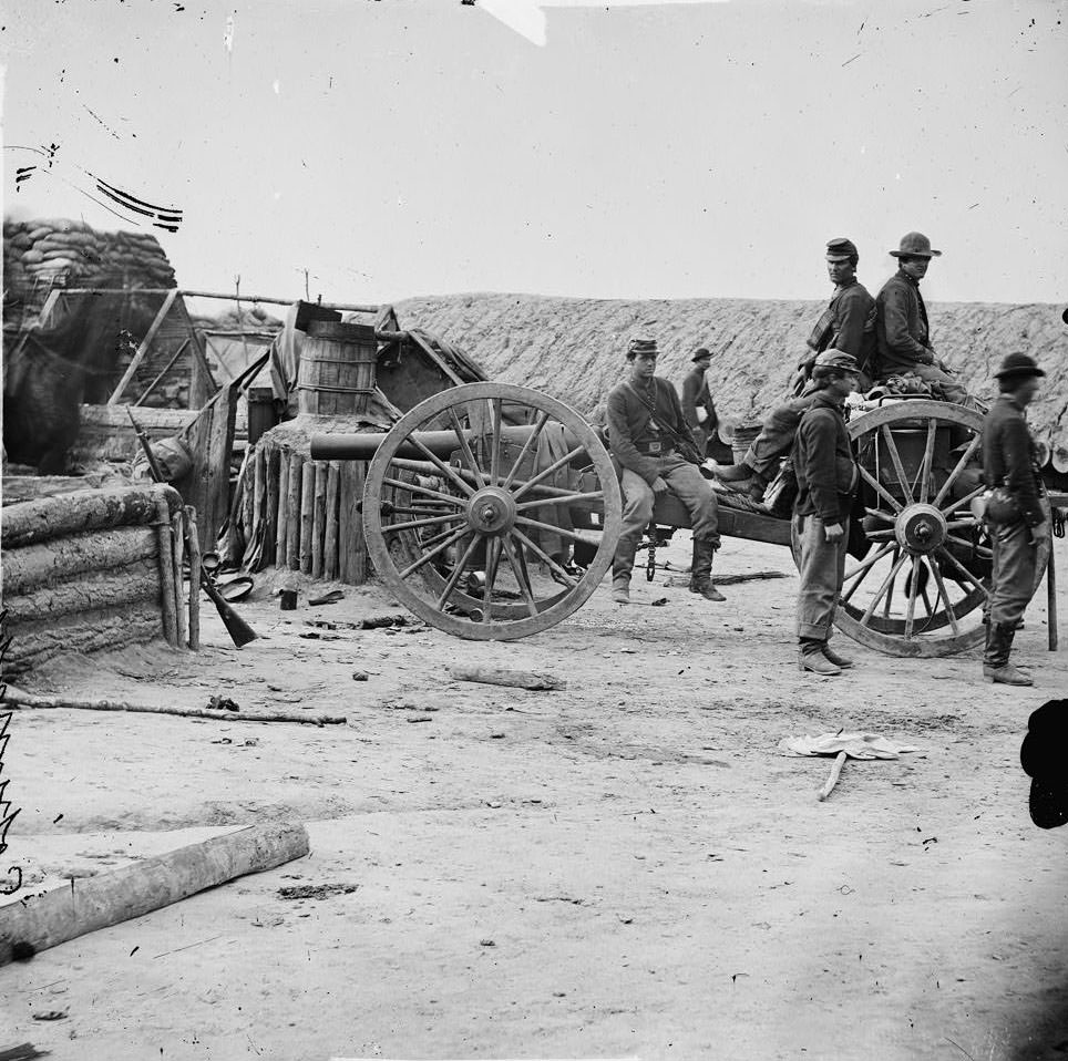 #167 Federal soldiers removing artillery from Confederate fortifications, Petersburg, 1865