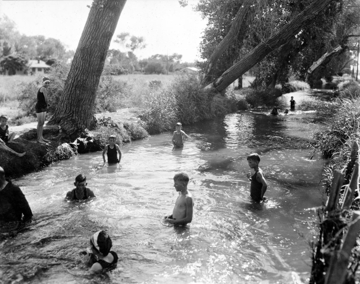 #90 Swimming in the Town Ditch or Swilling’s Ditch. It ran to Van Buren Street in the old townsite but was paved over by the 1930s.