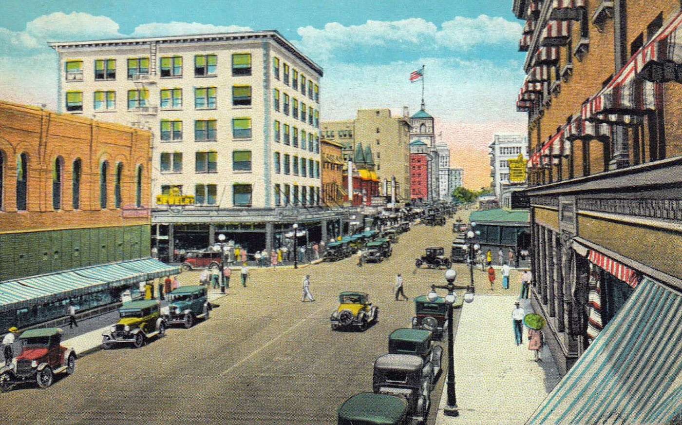 #91 A 1920s postcard shows the corner at Washington. The Heard and Security buildings are complete (the latter flies a flag). Phoenix leader Dwight Heard died in 1929.