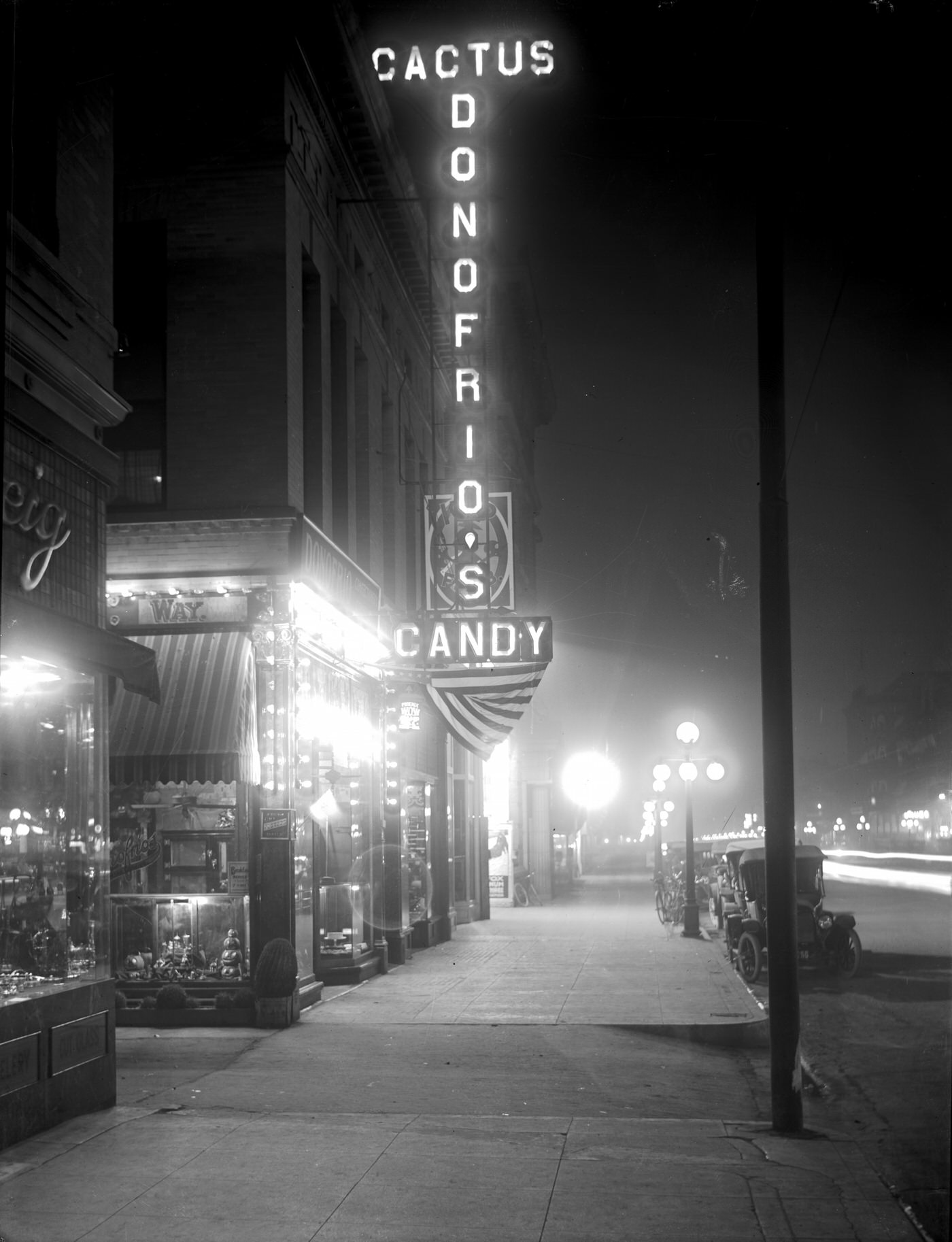 #62 Donofrio’s Candy Store at Night, 1917. This store was located on Washington Street in Phoenix.