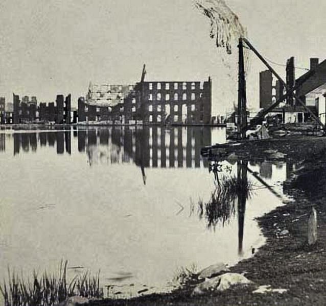 #122 Ruins of the burnt district, from the canal basin, Richmond, 1865
