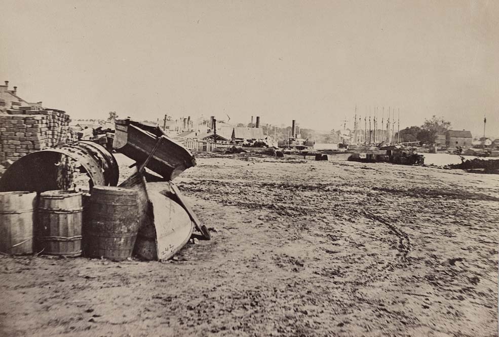 #78 Barrels and dinghies on the dock at Rockett’s Landing, 1865