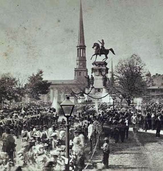 #43 A large crowd including uniformed soldiers gathered in front of the Washington Monument in Richmond, Virginia, 1860