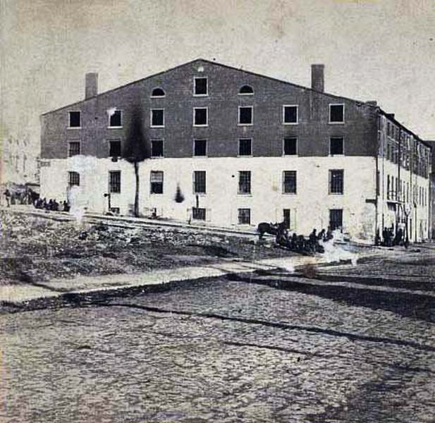 #87 An exterior view of the site of the Confederate military prison, 1861