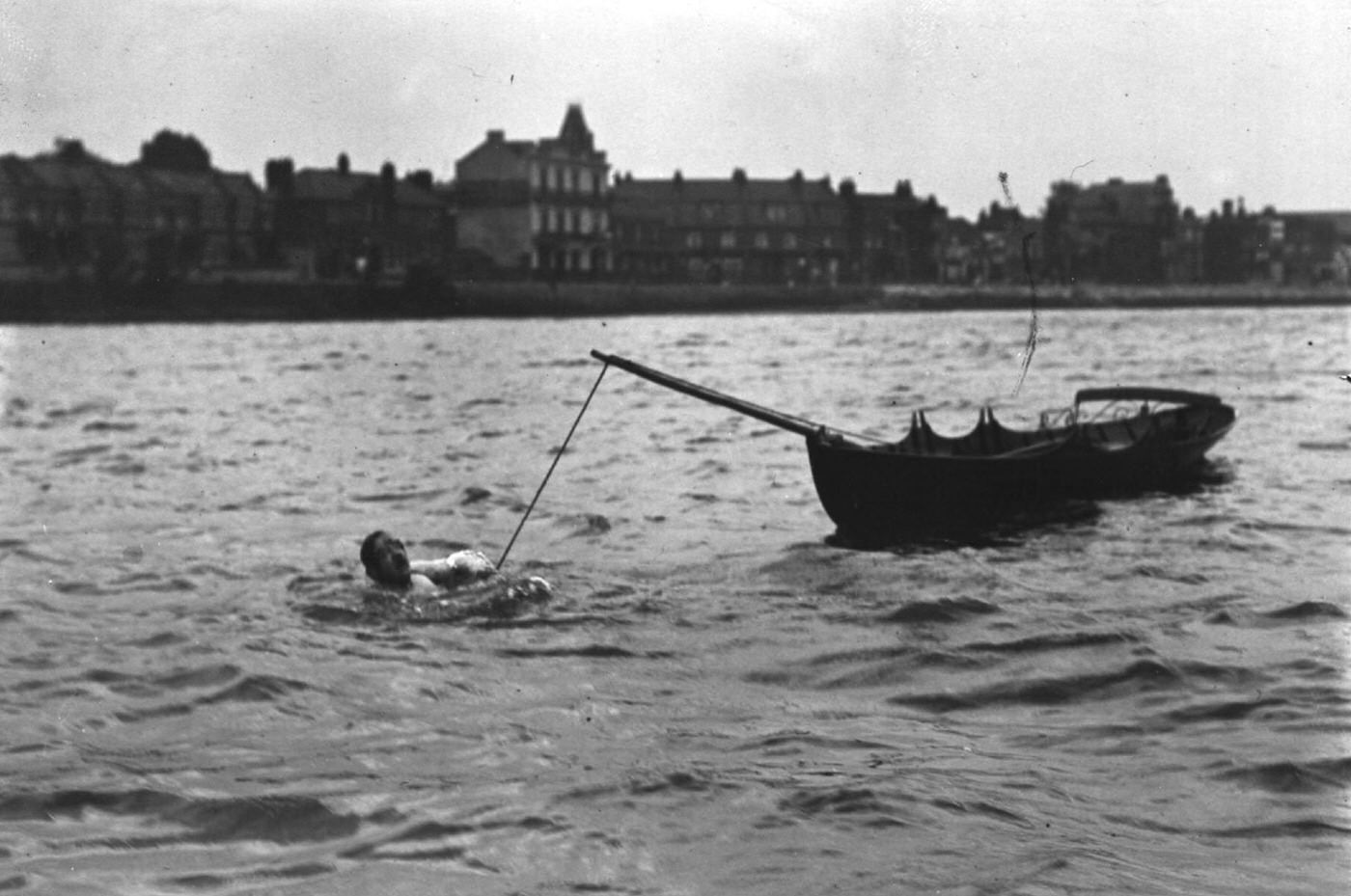 #129 Jules Gautier, manacled in the Thames, tows a boat from Mortlake to Putney, 1909
