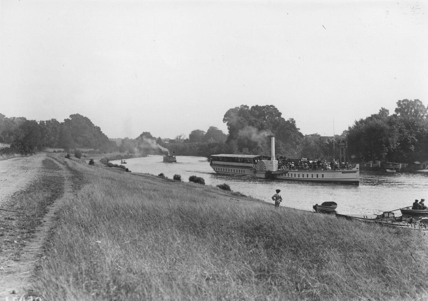 #130 The pleasure steamer, the ‘Queen Elizabeth’, coming up the River Thames from Kingston Bridge to Hampton Court, seen from the towpath, 1907
