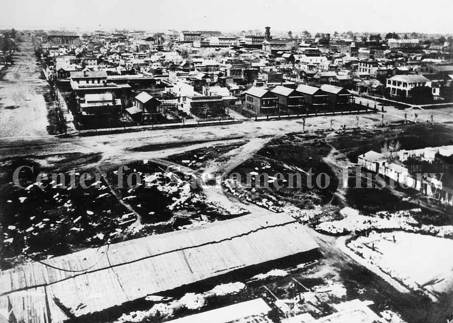 #77 Elevated view of Sacramento taken from the dome of the capitol during its construction looking northeast over the city, 1868
