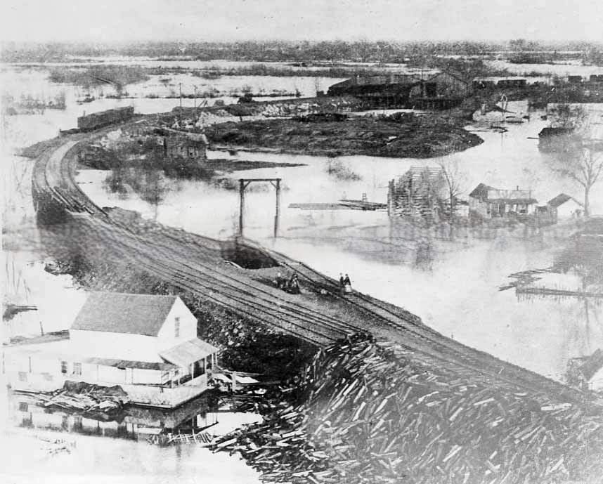 #79 An elevated view of Sacramento during the great flood of 1862. This view shows “China Slough” and the railroad construction project along I Street