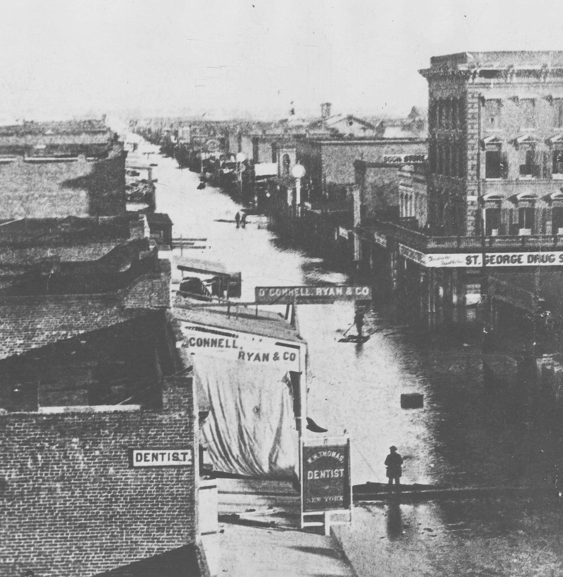 #101 Looking east, of a deluged J Street near Fourth Street captures the scale of the flood of December 1861.