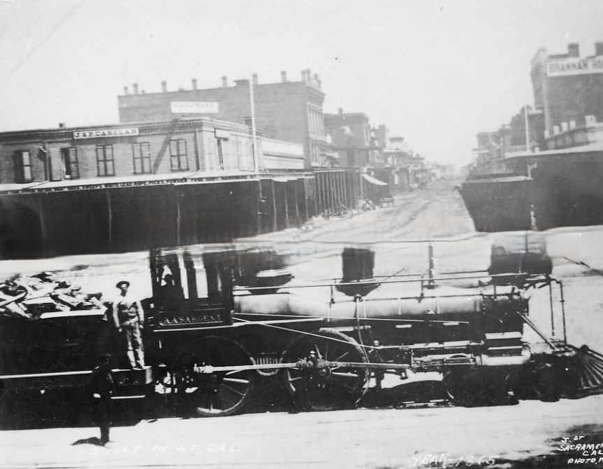 #93 Central Pacific engine, A.A. Sargent, at J and Front Streets, 1865