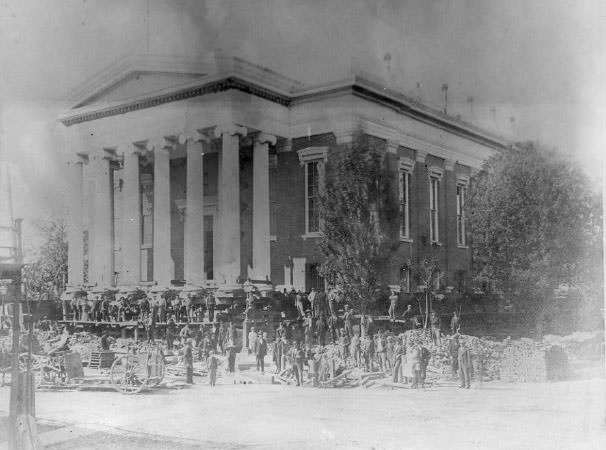 #28 The second Sacramento County Courthouse being raised during the street raising project of the 1860s.