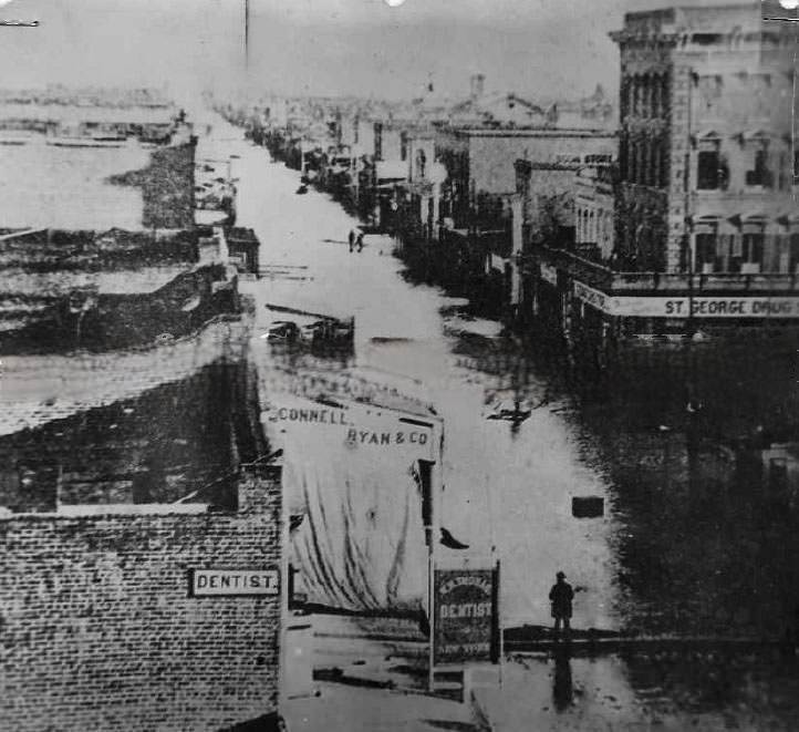 #36 Flood, J Street at 3rd Street, looking east, 1863
