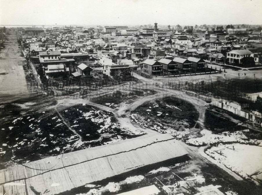 #40 Cityscape of Sacramento taken from the state capitol building under construction. Taken from the Capitol Building. 10th street L to M street, looking West, 1868