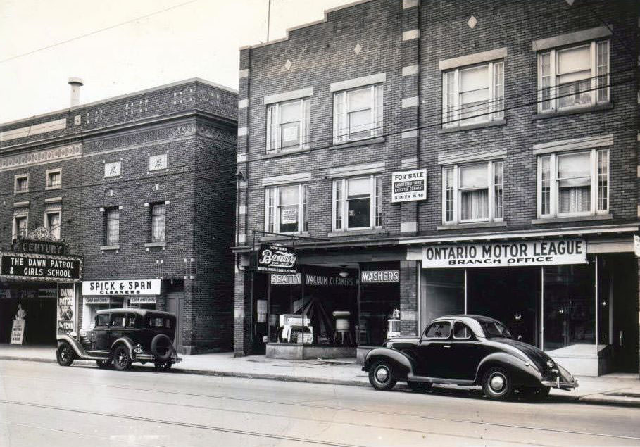 #131 145 Danforth Avenue. The Century Theatre can be seen at the left of the image adjacent to a Spick & Span Cleaners location, 1939