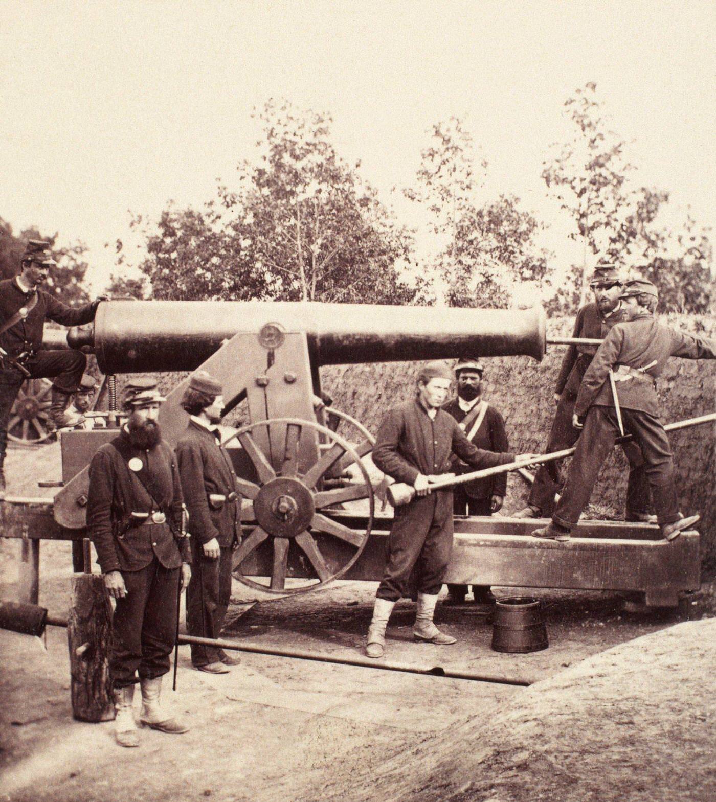 #84 Union gunners pose around a 32-pounder seacoast gun mounted at one of the many forts that protected Washington, D.C., 1860s
