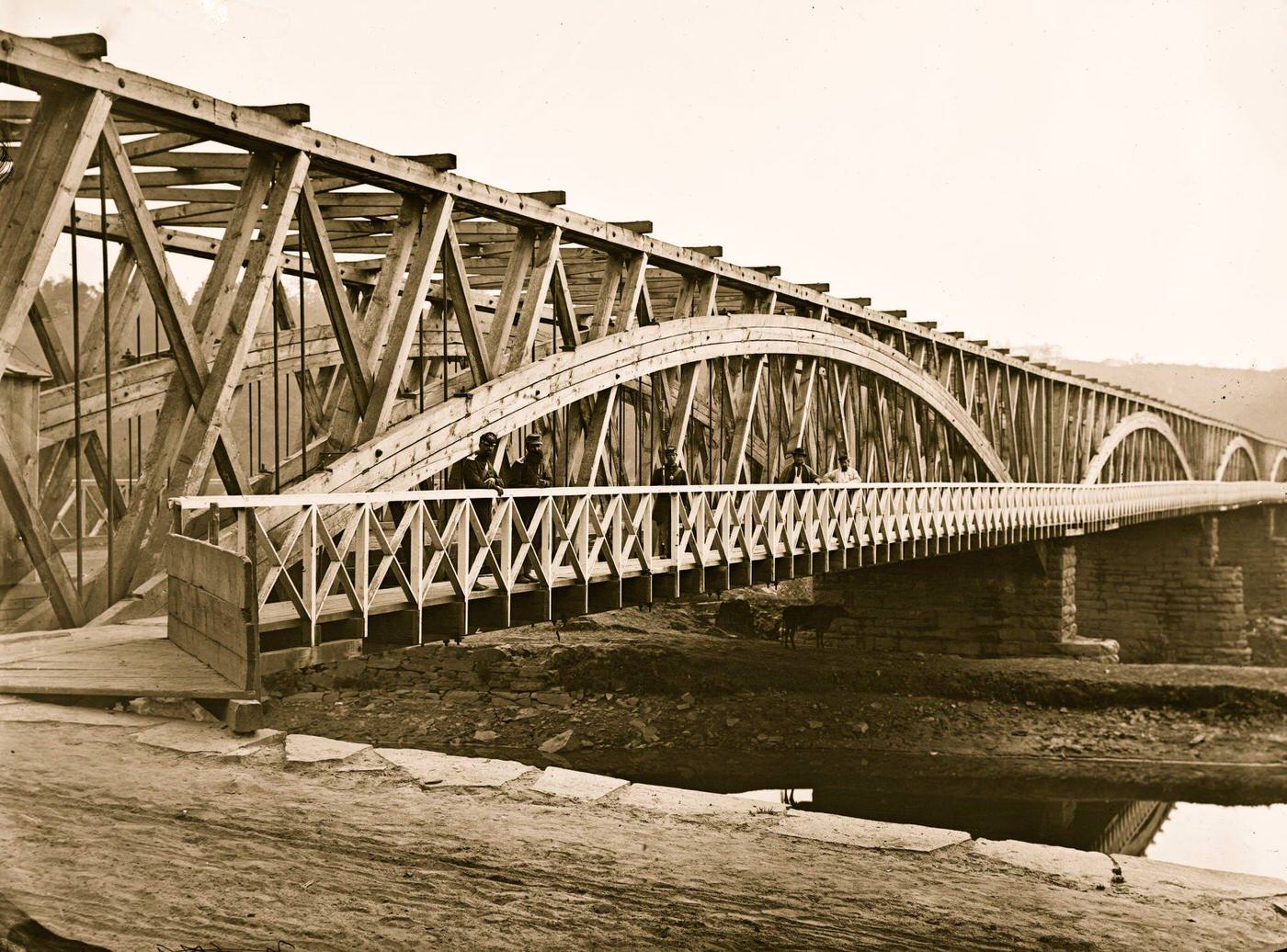 #112 Washington, D.C. Chain Bridge over the Potomac; Chesapeake and Ohio Canal in foreground, 1865
