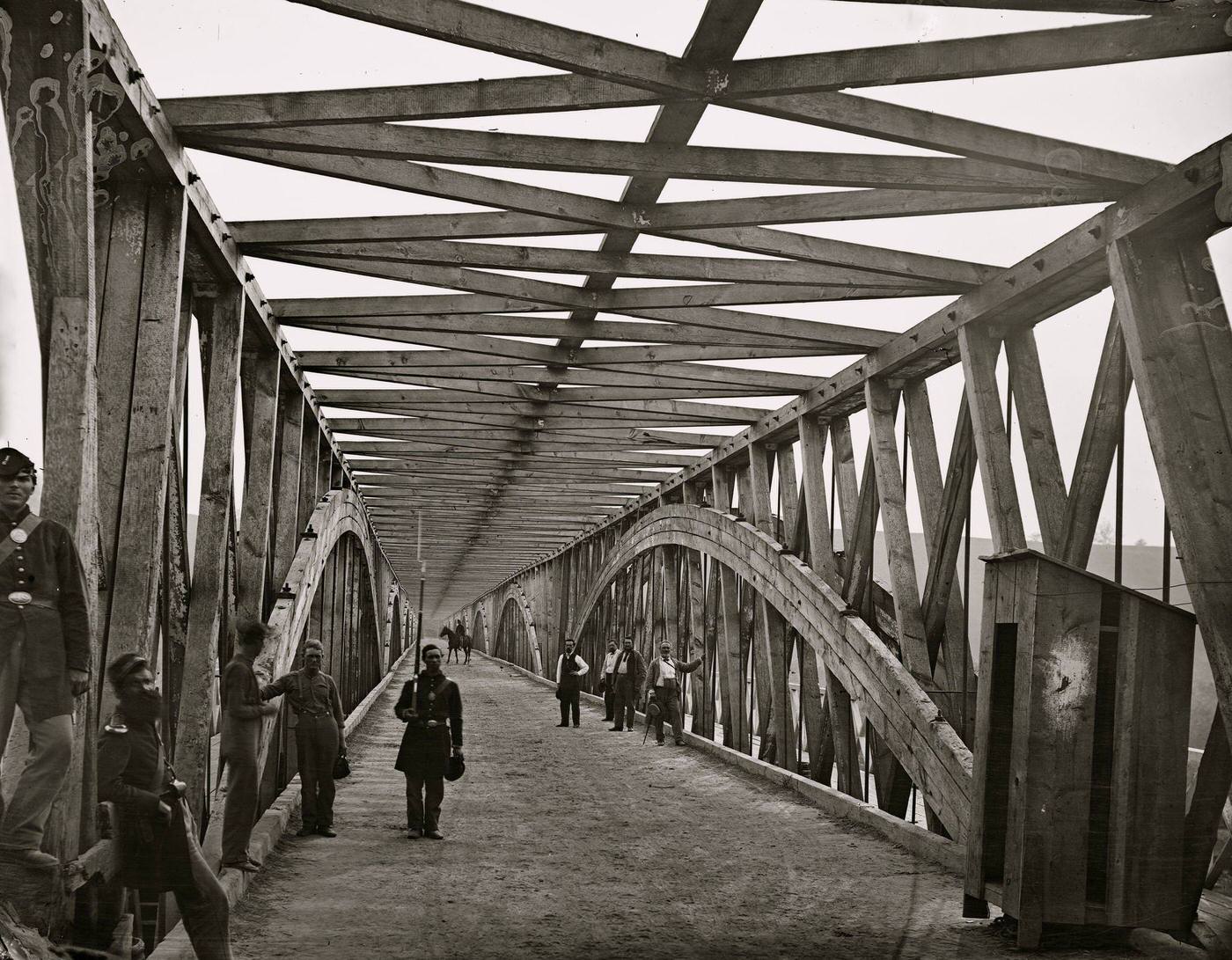 #163 The Chain Bridge over the Potomac, with soldiers and guardhouse visible, Washington, D.C., 1865