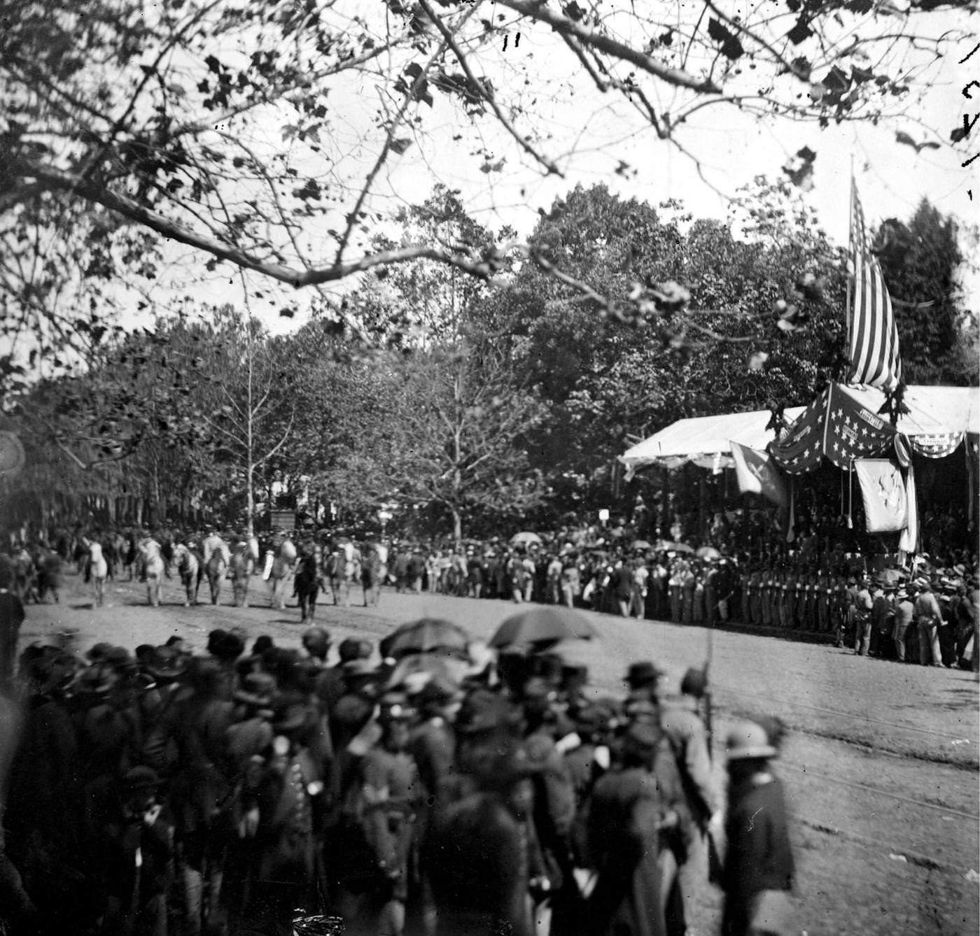 #164 Cavalry unit passing the Presidential reviewing stand, with guests and guard, during the “grand review” of the Union Army, Washington, D.C., 1865